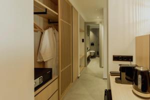a kitchen with a hallway leading to a bathroom at Opal Paros in Naousa