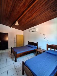 Postel nebo postele na pokoji v ubytování Casa em Ilhabela