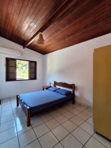Postel nebo postele na pokoji v ubytování Casa em Ilhabela