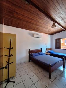 Postel nebo postele na pokoji v ubytování Casa em Ilhabela