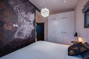 Postel nebo postele na pokoji v ubytování Villa Pulla a modern holiday home in Ruka