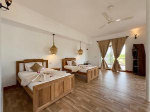 Postel nebo postele na pokoji v ubytování Shirley Residence Kiwengwa