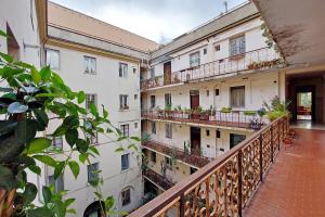 two views of an apartment building from a balcony at YCH-Luminoso appartamento nel cuore di Testaccio in Rome