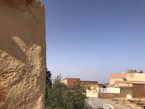 a view of a city with buildings in the background at La maison des oiseaux in Tlemcen
