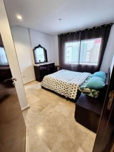 Postel nebo postele na pokoji v ubytování Charmant Studio - Vue sur mer