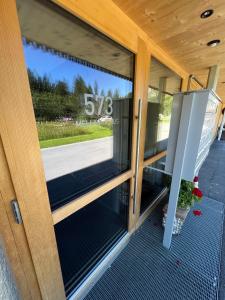 a sliding glass door of a building with a window at Apartment Kanisfluh in Mellau