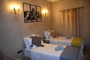 Postel nebo postele na pokoji v ubytování Riad Mogantique-Essaouira