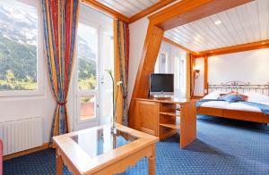 Postel nebo postele na pokoji v ubytování Derby Swiss Quality Hotel