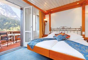 Postel nebo postele na pokoji v ubytování Derby Swiss Quality Hotel