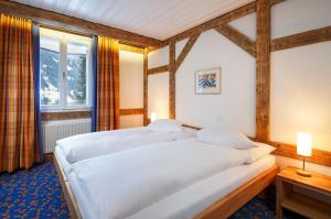 Postel nebo postele na pokoji v ubytování Derby Swiss Quality Hotel
