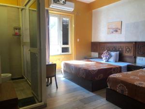 Ένα ή περισσότερα κρεβάτια σε δωμάτιο στο The location Hotel