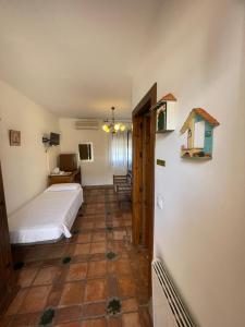 Postel nebo postele na pokoji v ubytování La Hacienda del Marquesado