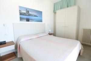 Katil atau katil-katil dalam bilik di Hotel Approdo di Venere