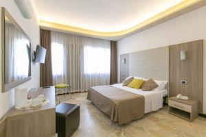 Postel nebo postele na pokoji v ubytování Hotel Boomerang Roma