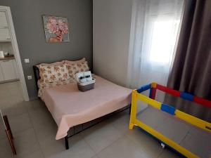 Postel nebo postele na pokoji v ubytování IRIS Apartment