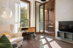 TV a/nebo společenská místnost v ubytování GO Apartments - ApartHotel