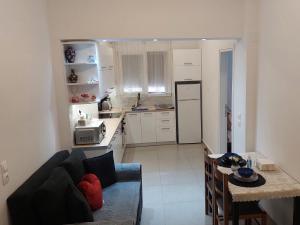 Kuchyň nebo kuchyňský kout v ubytování IRIS Apartment