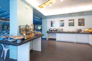 a bakery with pastries on display in a room at Plus Florence in Florence