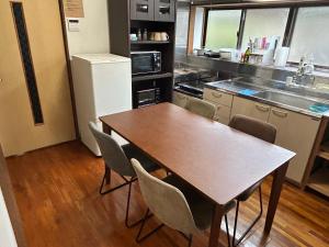 A kitchen or kitchenette at ポートサイドSasebo藤原町