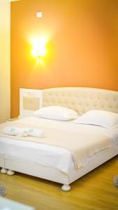 Postel nebo postele na pokoji v ubytování Garden Hotel