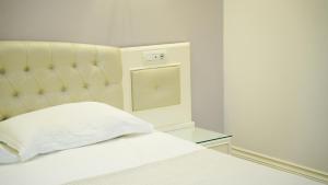 Postel nebo postele na pokoji v ubytování Garden Hotel