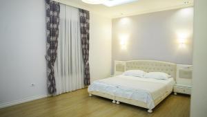Postel nebo postele na pokoji v ubytování Garden Hotel