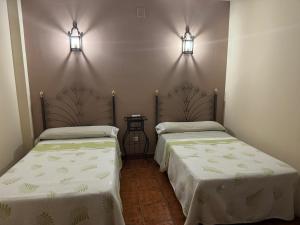 A bed or beds in a room at La Garzona