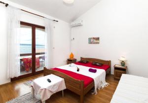 Posteľ alebo postele v izbe v ubytovaní Apartments Neva