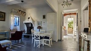 a kitchen and dining room with a table and chairs at Sea House in Galaxidi