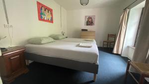 Postel nebo postele na pokoji v ubytování La Buse