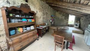 a kitchen with a table and a dining room at La Buse in Saint-Jean-Saint-Gervais