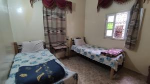 Postel nebo postele na pokoji v ubytování hôtel oasis tinghir