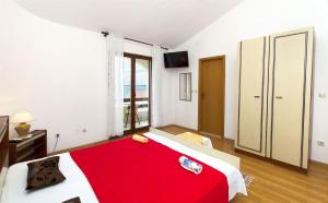 Posteľ alebo postele v izbe v ubytovaní Apartments Neva