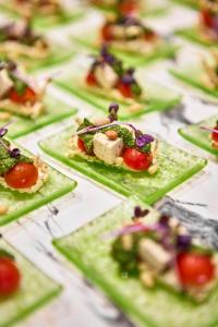 a bunch of appetizers on plates on a table at Hotel Astoria Playa Adults Only 4* Sup in Port d'Alcudia