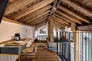 an attic office with wooden ceilings and a desk at Chalet Cotes du Lavancher in Chamonix-Mont-Blanc