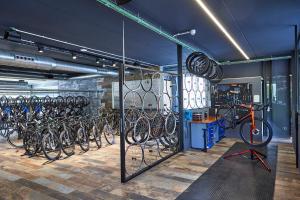 a room with a bunch of bikes parked in it at Hotel Astoria Playa Adults Only 4* Sup in Port d'Alcudia