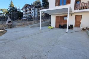 a large parking lot in front of a house at Marsila in Camigliatello Silano