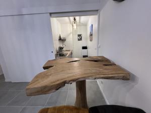 a wooden table in the middle of a room at Le Studio de la Grand Place in Arras