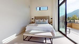 Ένα ή περισσότερα κρεβάτια σε δωμάτιο στο The Residences at One Twenty Unit 302