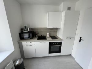 Køkken eller tekøkken på Le Cocon Naturel - Studio 2p Ville fortifiee + 3 billeder