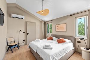 a bedroom with a large bed and a chair at Villa Sentiero in Pazin +43 photos