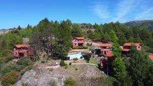 an aerial view of a house on a mountain at Cabañas del Peñón in La Cumbrecita