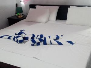 Postel nebo postele na pokoji v ubytování Goyambokka Peacock Guest