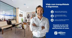 a man standing in a room with his arms crossed at Hotel Dan Inn Express Ribeirão Preto By Nacional Inn in Ribeirão Preto +42 photos