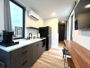 a kitchen with a sink and a large window at Wild Sage in Orderville