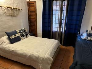 Voodi või voodid majutusasutuse Villa Macadamia toas