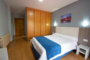 Posteľ alebo postele v izbe v ubytovaní Hotel Campomar