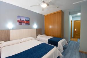 Posteľ alebo postele v izbe v ubytovaní Hotel Campomar