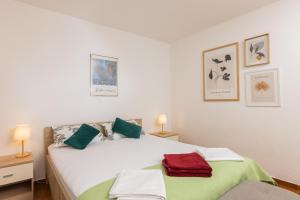 a bedroom with two beds with green and white at Pietro in Korčula +58 photos