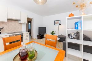 a kitchen and a living room with a table at Pietro in Korčula